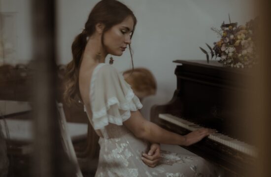 Bride playing piano during her Villa Valentina Elopement, an intimate wedding in Italy