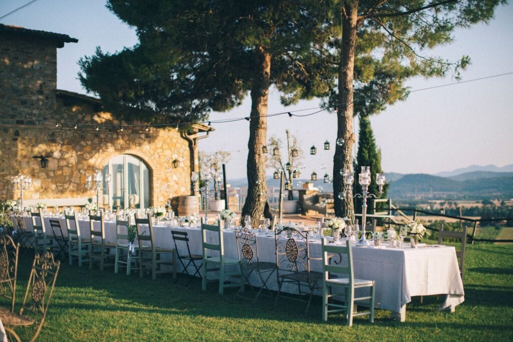 Wedding reception with tables in the garden of Conti San Bonifacio - Tuscany Wedding Venues