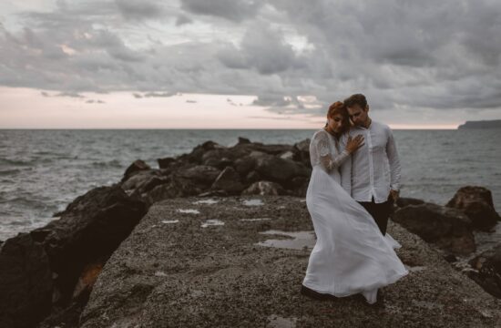 Bride & Groom hugging near a beach at sunset during their Cinque Terre Wedding in Italy