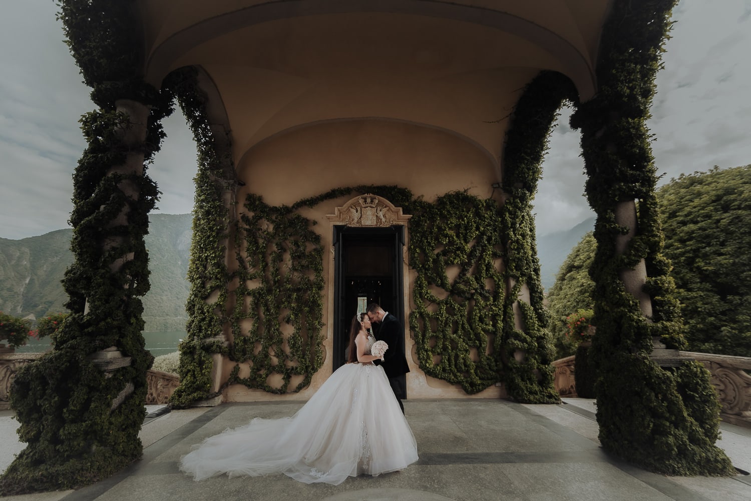 Bride and groom at loggia in Villa del Balbianello during Italy Elopement