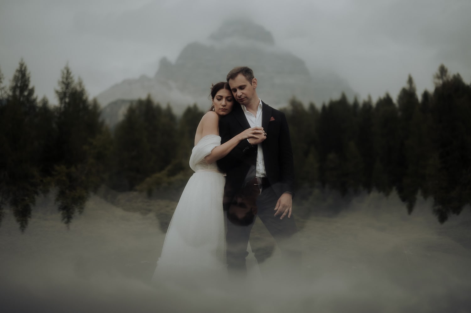 Bride and groom hugging in front of Lavaredo in the Dollomites during Italy Elopement