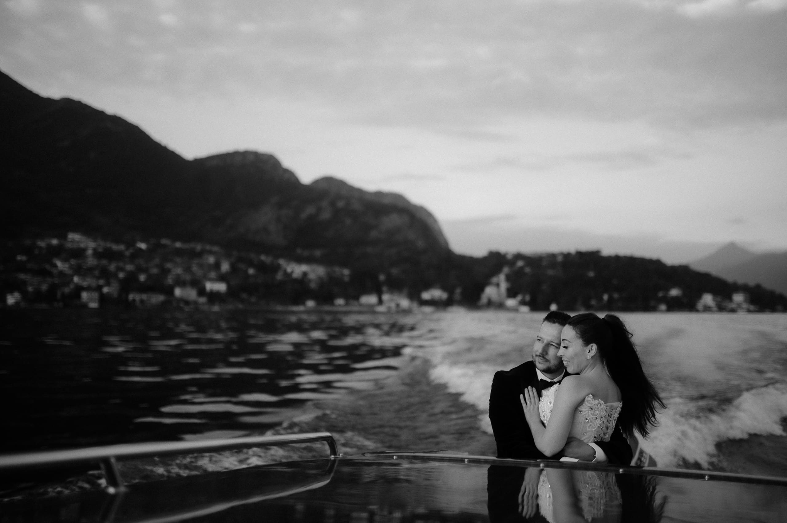 Bride and groom enjoying boat ride at Lake Como Elopement Guide