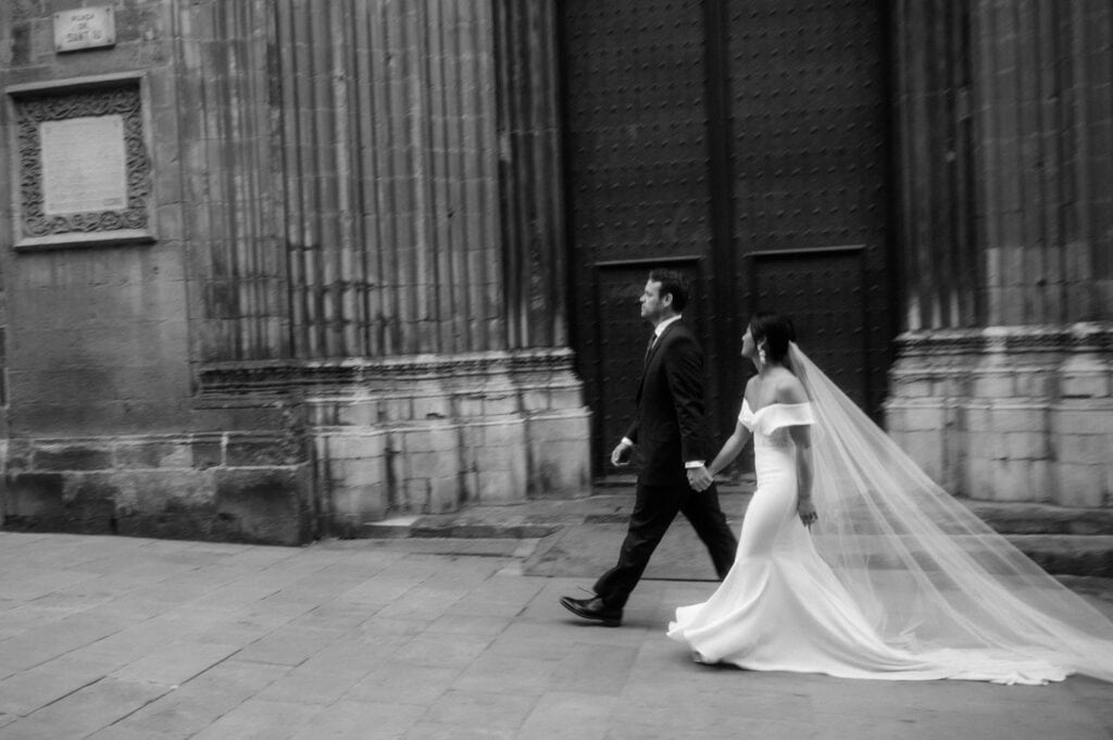 bride and groom walking during Barcelona elopement