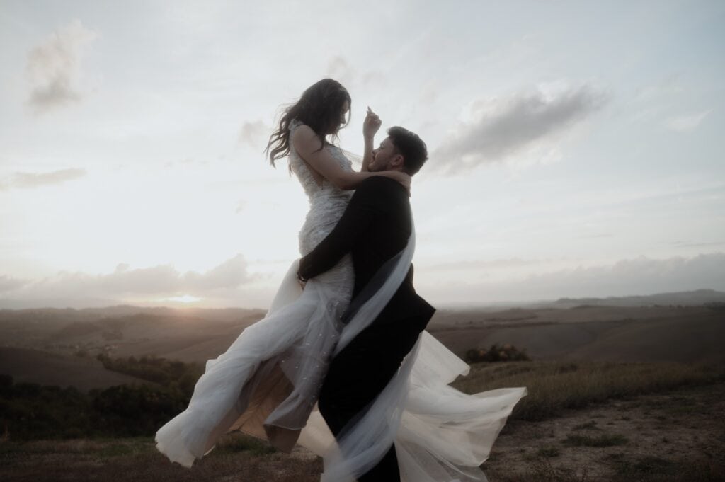 bride and groom dancing at sunset during Tuscany elopement